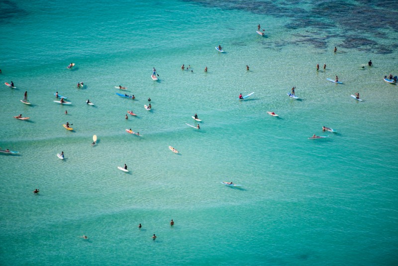 Deep Blue Waters of Kakaʻako with lots of surfers
